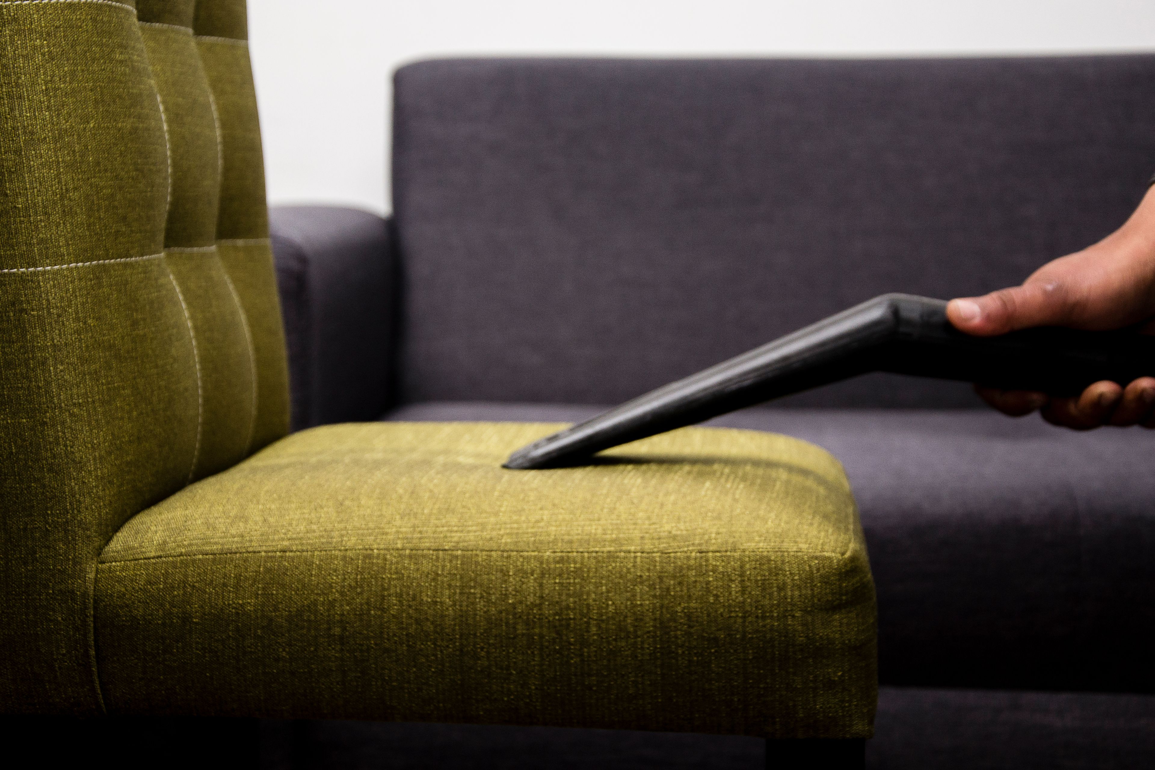 Deep-vacuuming a sofa