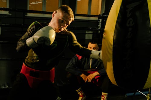 A Boxer Punching the heavy Bag in Training