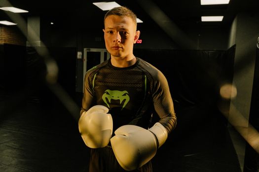A Man in Active Wear Wearing Boxing Gloves 
