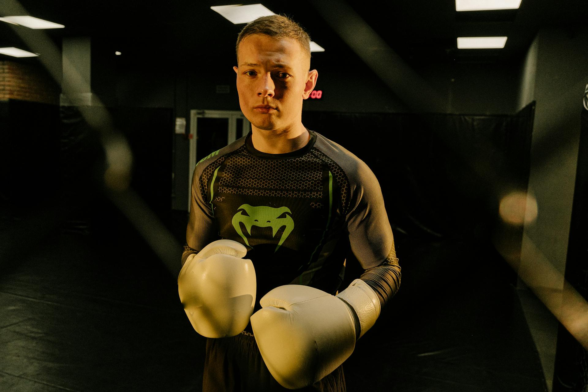 A Man in Active Wear Wearing Boxing Gloves