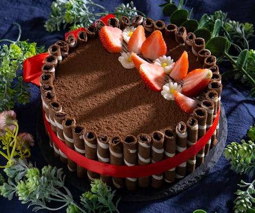 Free Chocolate Cake Surrounded with Chocolate Stick Stock Photo