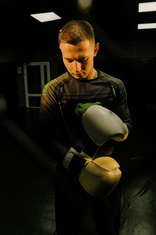 A Man Wearing Boxing Gloves