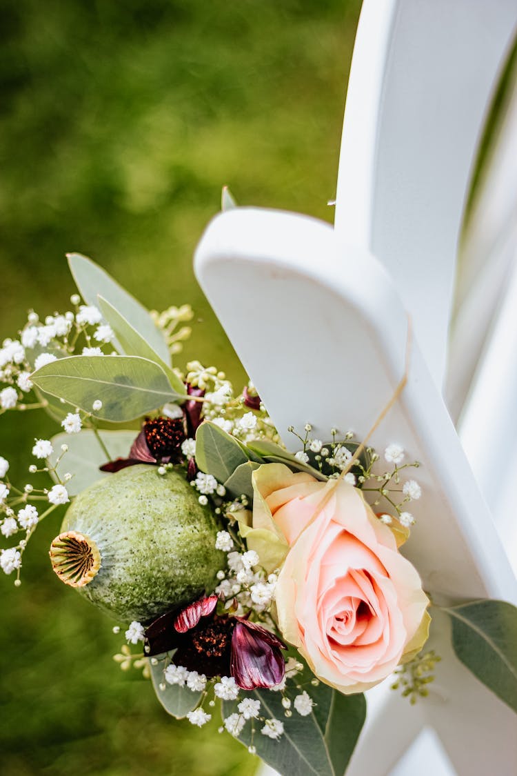 Flowers Hanging On White Chair