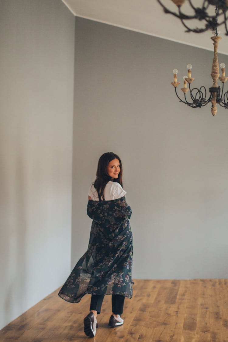 Backside Of A Woman Wearing A Floral Shrug