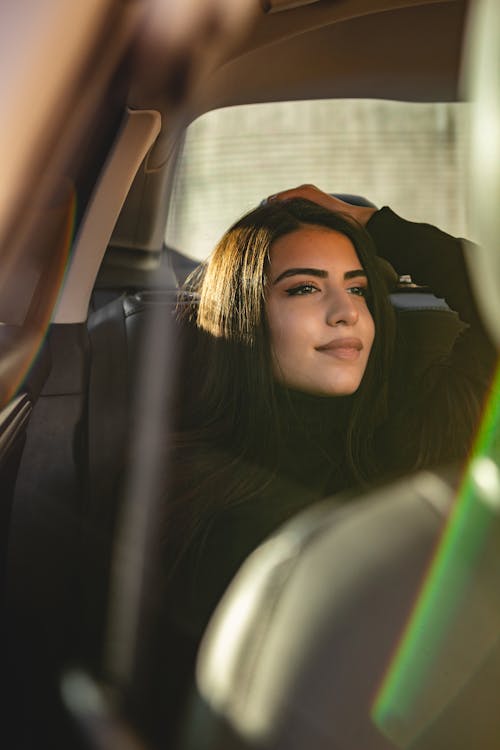 Free A Woman Sitting Inside a Car Stock Photo