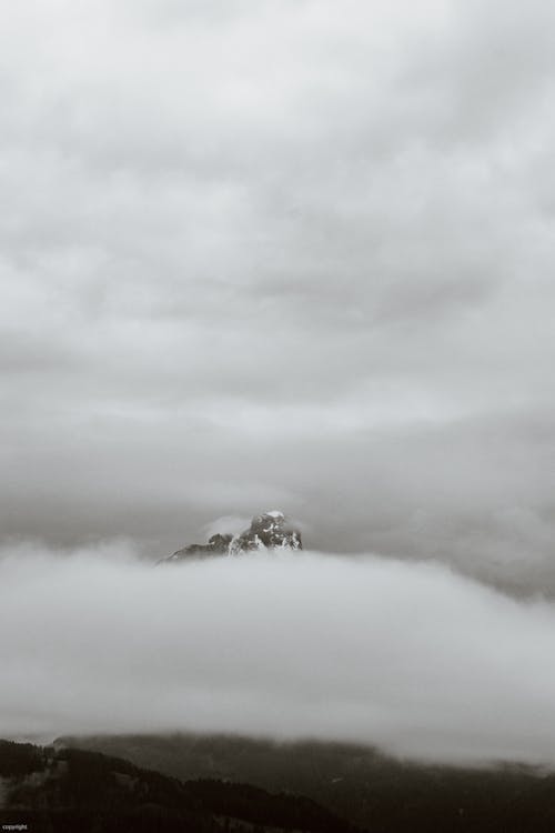 Foggy sky over mountains on overcast day