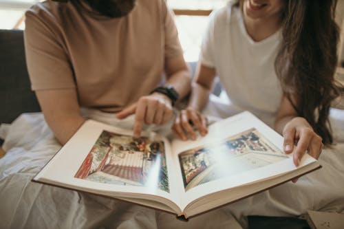 Free People Reading a Book Together Stock Photo