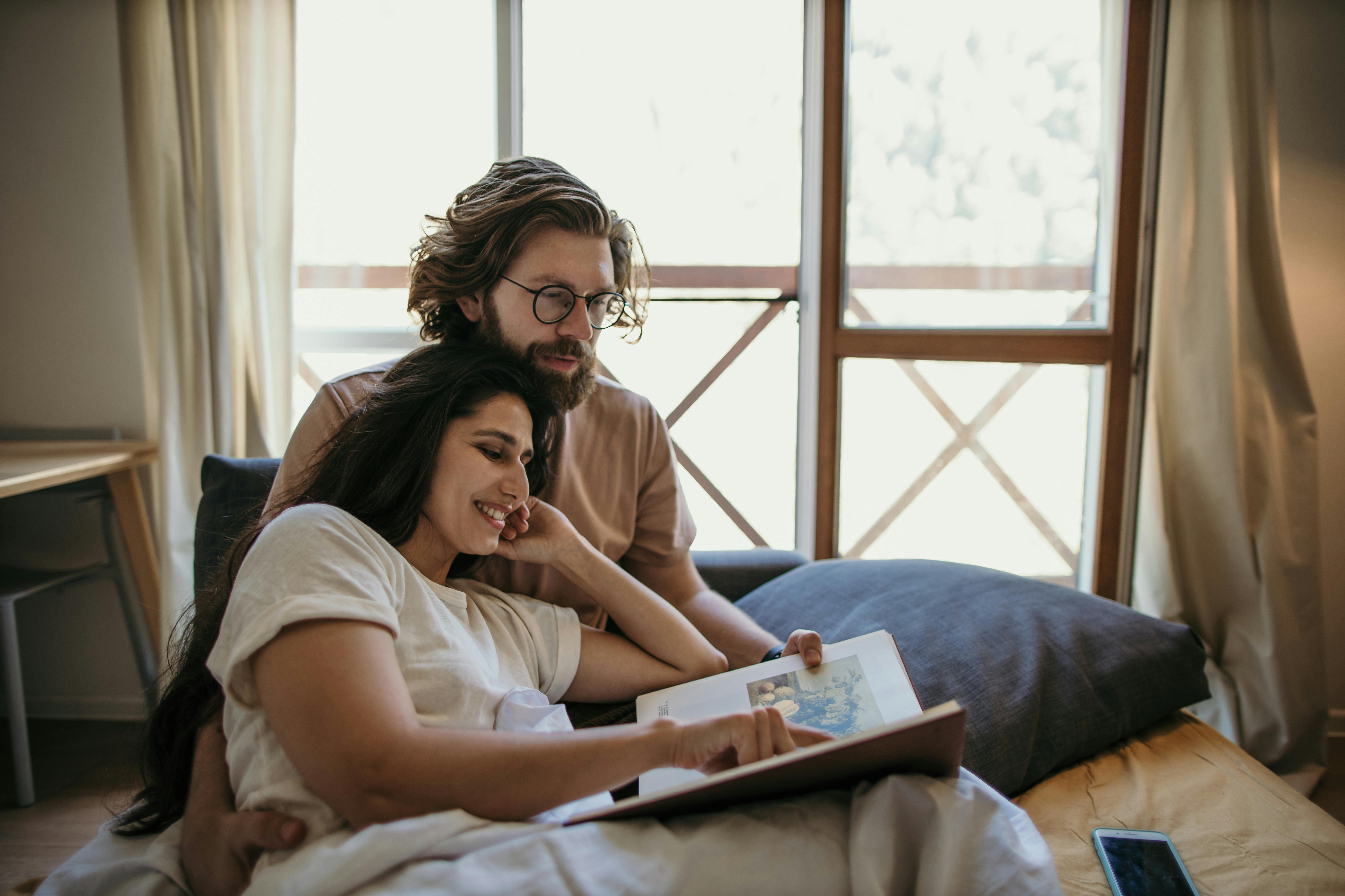 sweet couple reading a book together