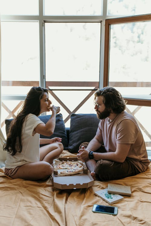 Couple Eating Pizza Together