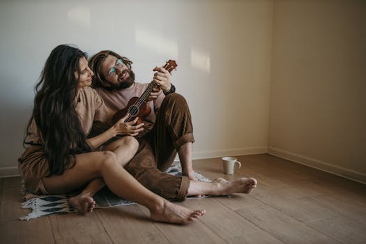 Couple enjoying music together at home, playing ukulele in a relaxed setting.