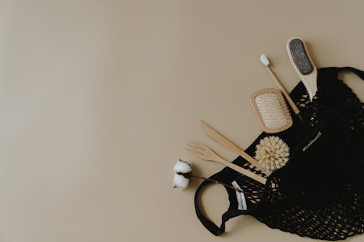 Flat lay of zero waste personal care items in a mesh bag on a neutral background.