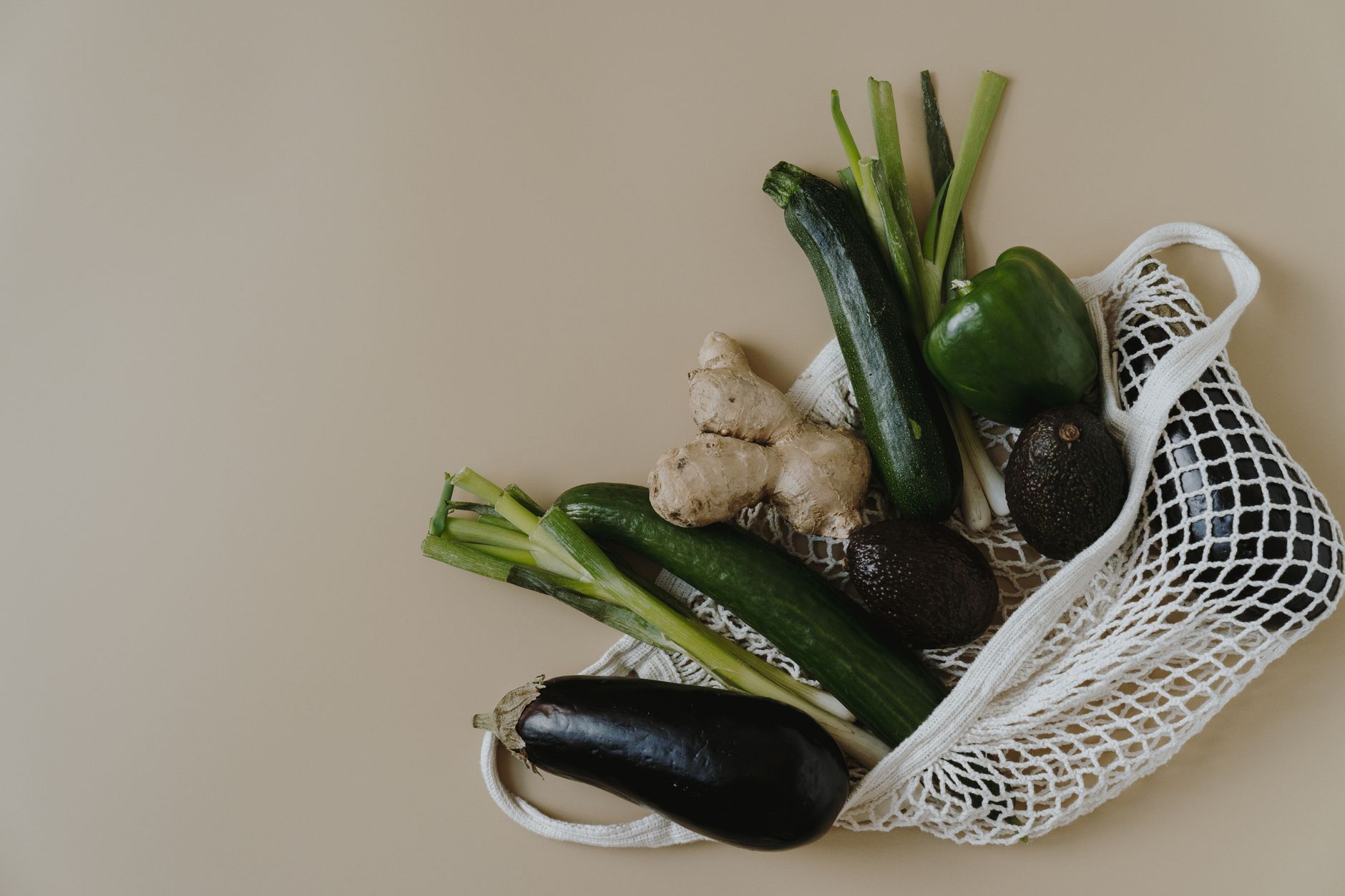 The Ultimate Dairy-Free Zucchini Dish You'll Love A variety of vegetables in a mesh bag highlighting healthy and zero waste shopping.