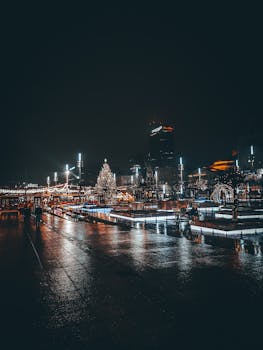 Nighttime view of a Christmas market in Katowice, Poland, with festive lights and decorations.