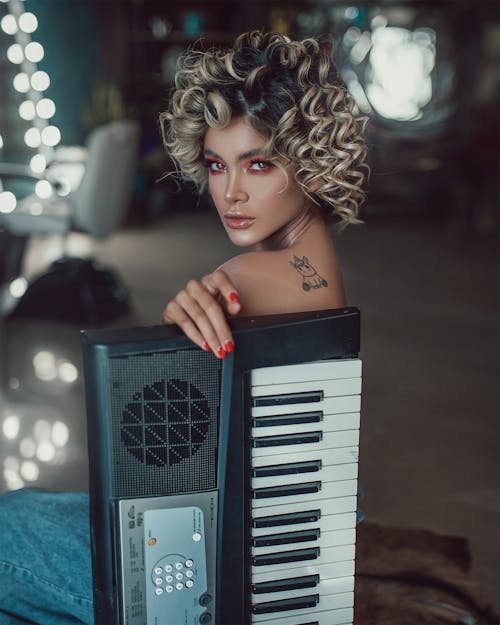 A Woman Holding Electronic Keyboard