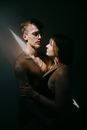 Young sensual couple embracing and looking at each other