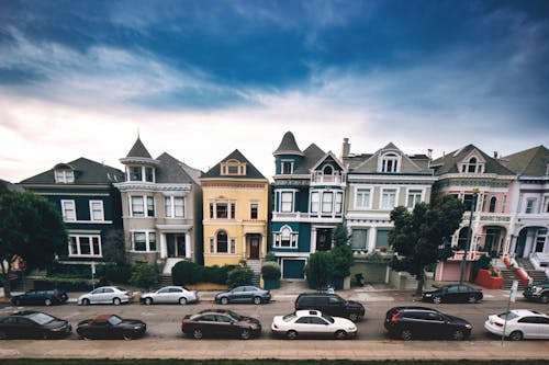 Exterior of contemporary multicolored residential cottages built in Victorian and Edwardian styles in famous San Francisco district called Painted Ladies