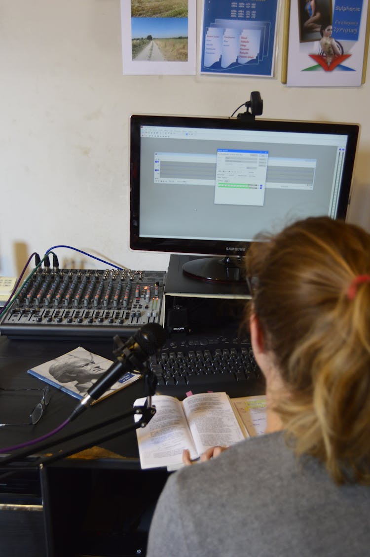 Unrecognizable Sound Engineer Installing Software On Desktop Computer At Home