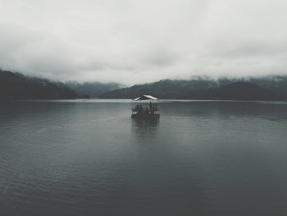 People Riding a Boat on Phewa Lake in Pokhara, Nepal