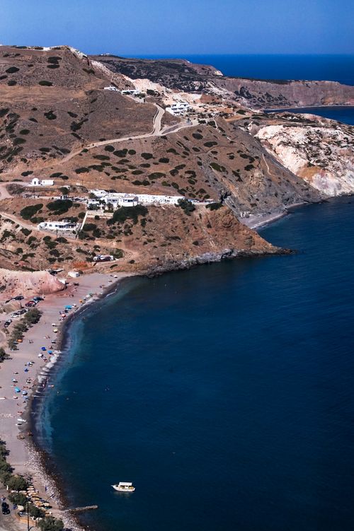 Free Stunning aerial view of Mylos coastline in Greece with clear blue waters and rocky cliffs. Stock Photo