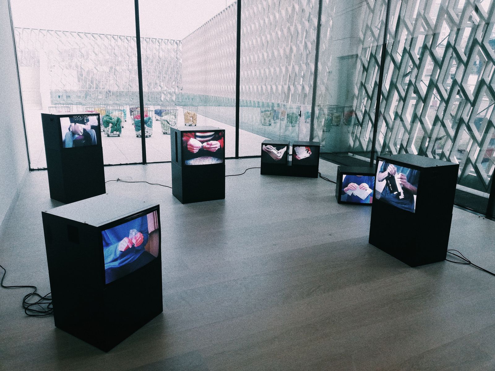 Digital art displayed on museum screens; illustration of digital collectibles