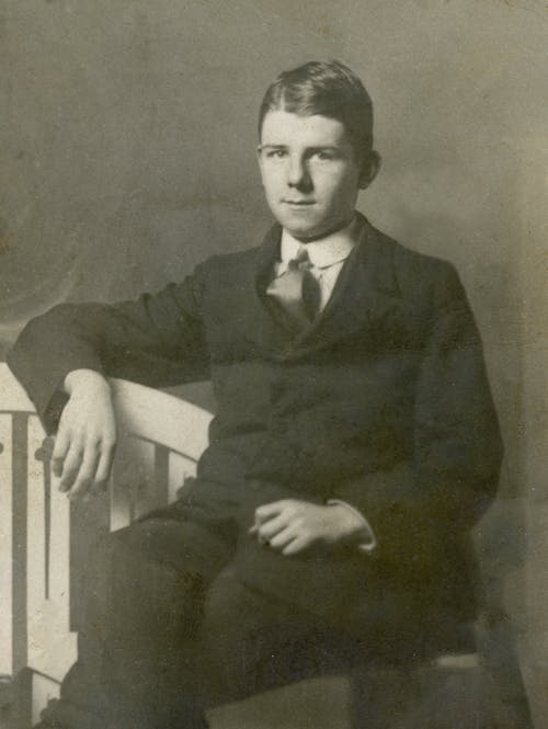 Vintage Photo of Young Man in Black Suit 