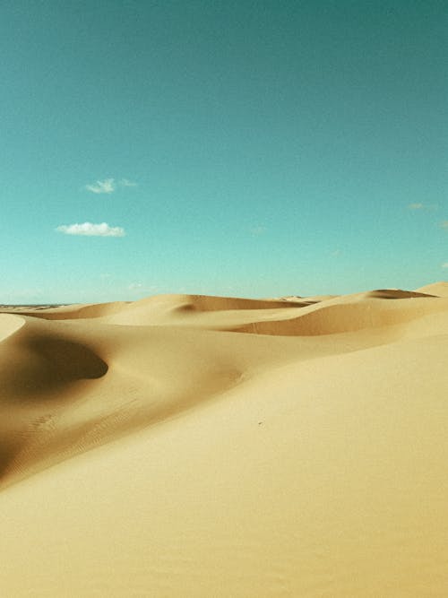 Free Sand Dunes Under Blue Sky Stock Photo