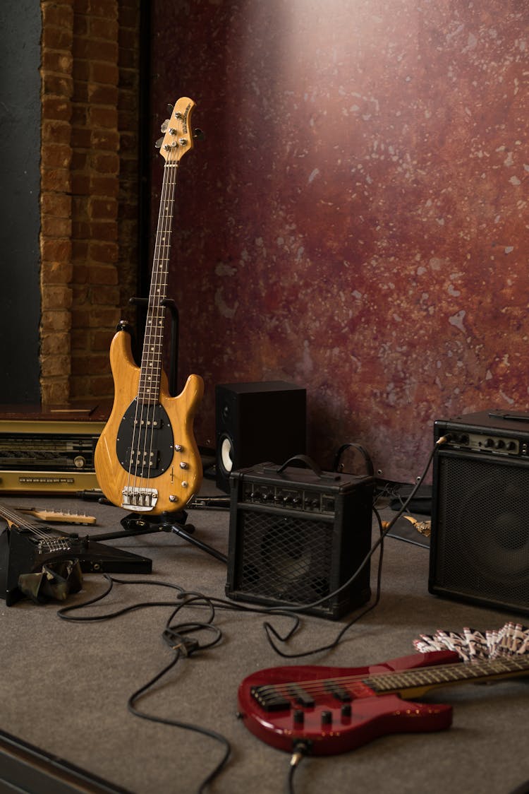 Various Electric Guitars And Amplifiers On Stage In Studio