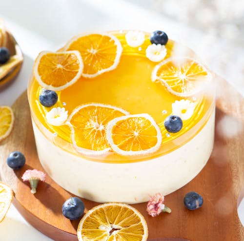 Free Orange Cheese Cake With Fresh Oranges Decoration Stock Photo