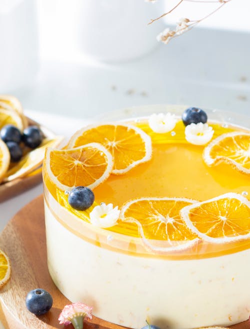Orange Cheese Cake With Fresh Oranges and Blueberries Decoration