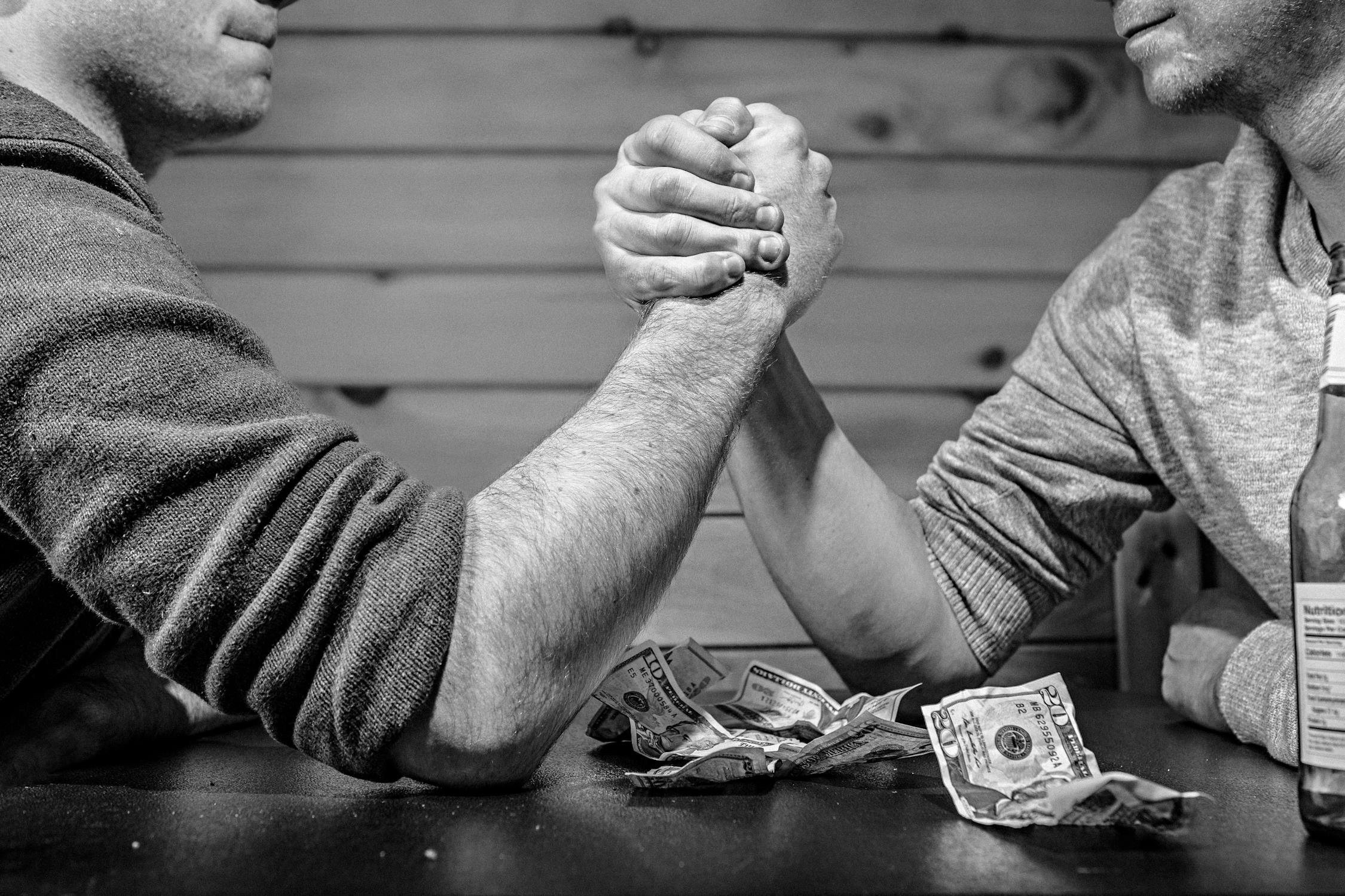 Two men hand wrestling