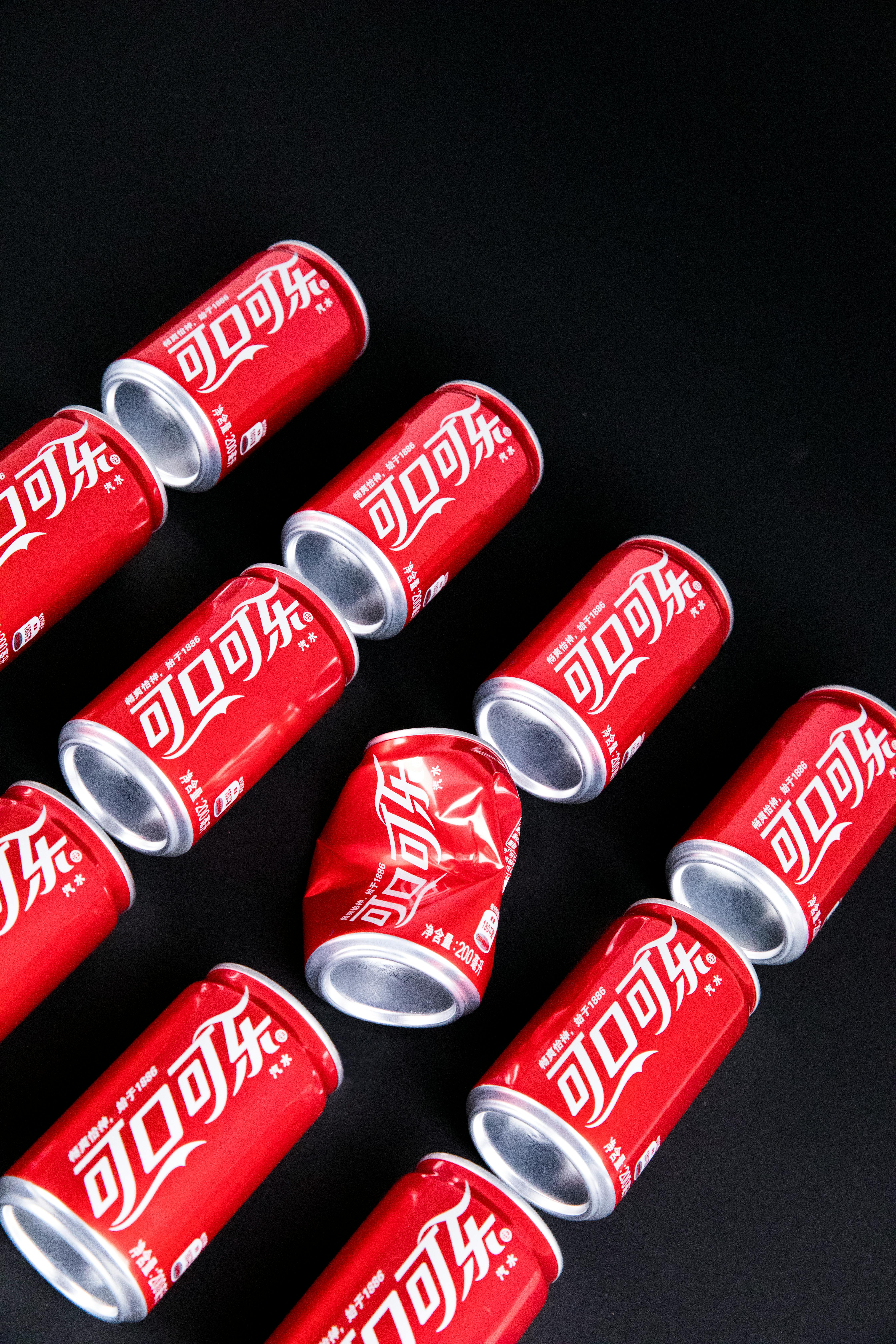 set of metal cans with soda