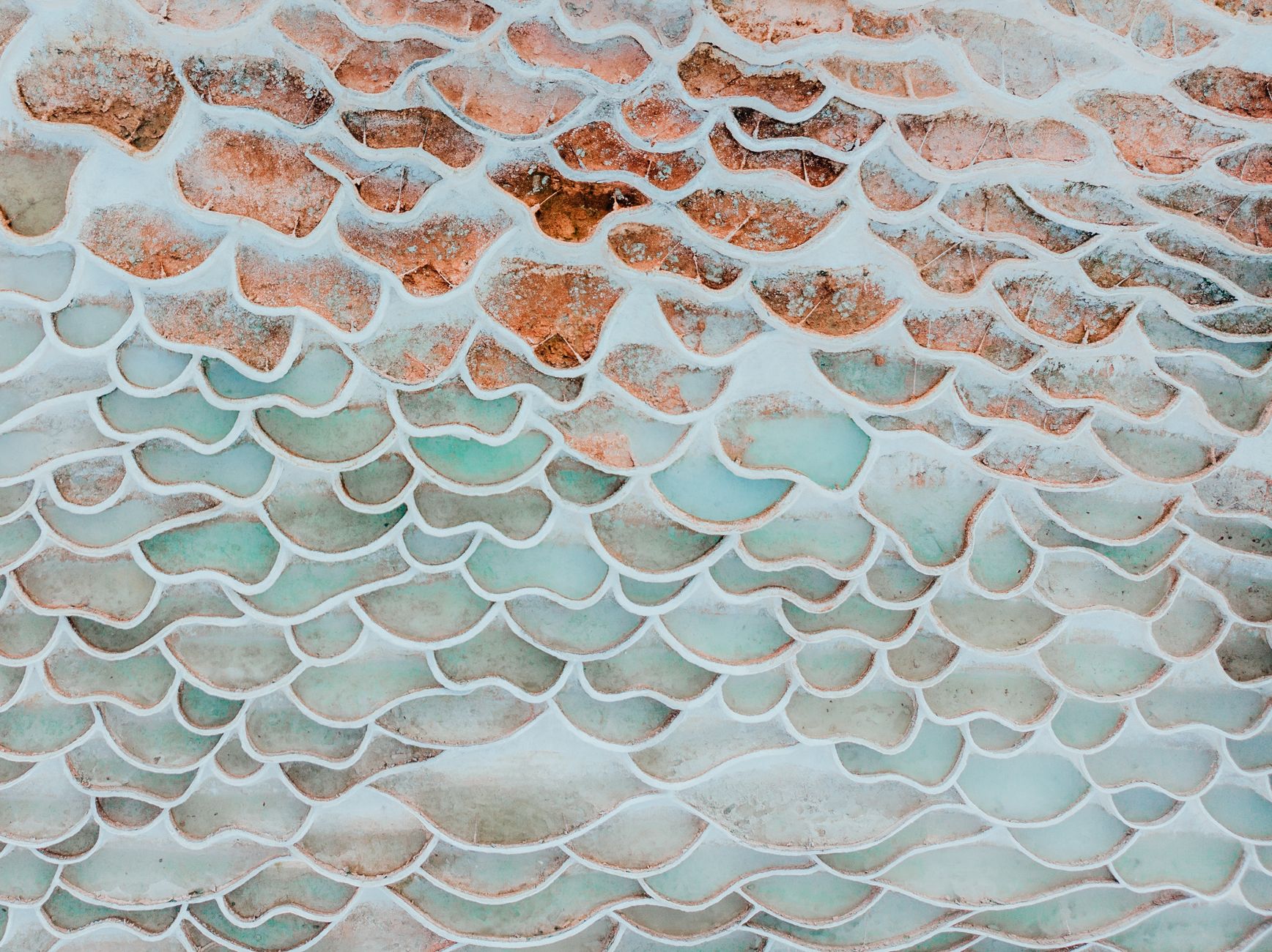 Intricate pattern of travertine formations at Egerszalók thermal springs in Hungary.