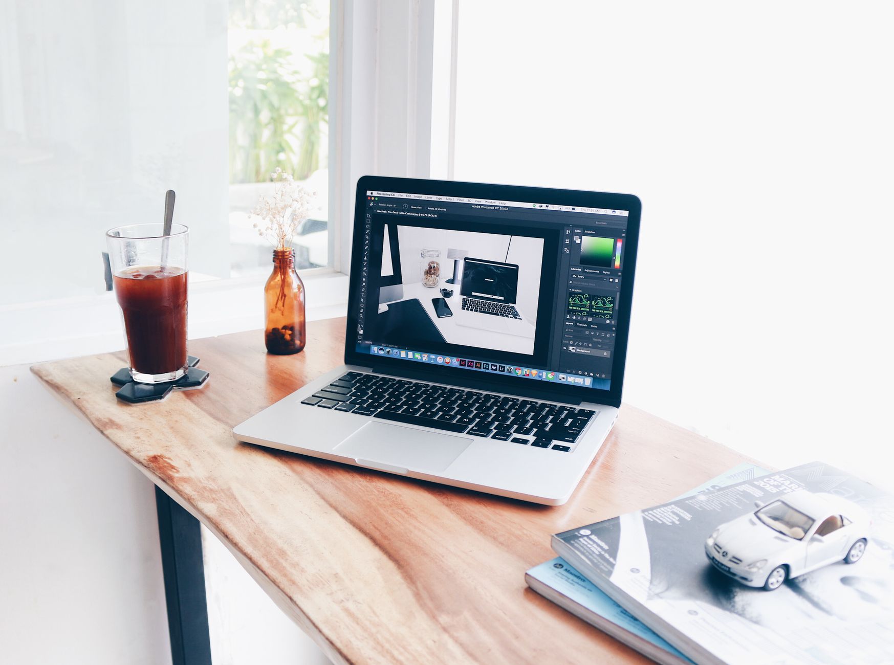 Silver Macbook Pro on Brown Wooden Table · Free Stock Photo