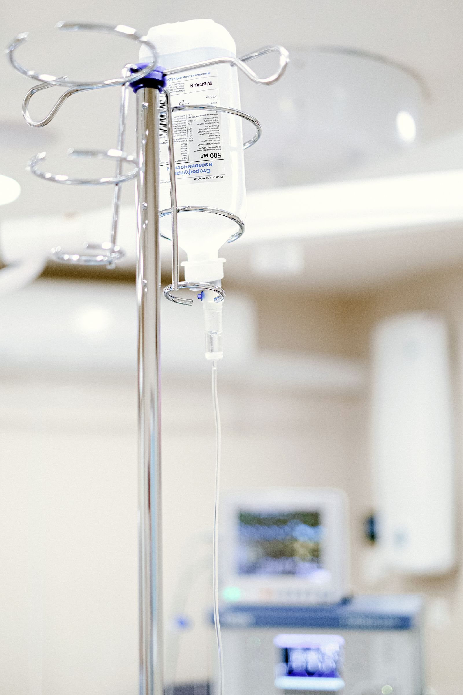 A close view of an intravenous drip in a sterile clinical setting
