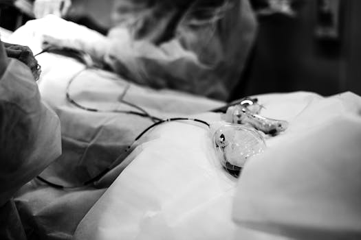 Black and white image of a surgical procedure highlighting medical equipment.