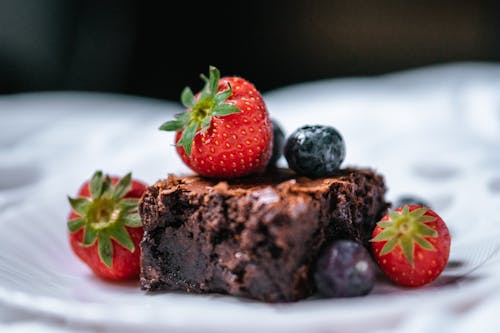 Strawberry on Chocolate Cake on White Ceramic Plate