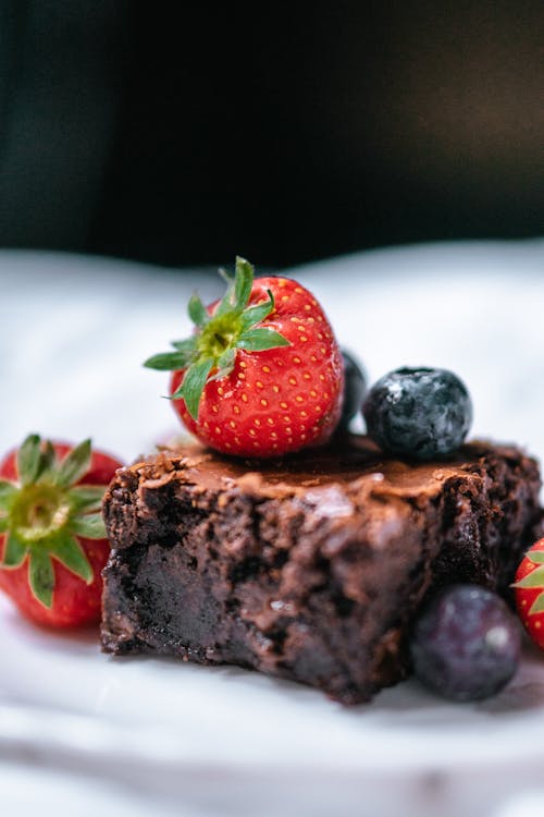 Slice of chocolate dessert with fresh berries