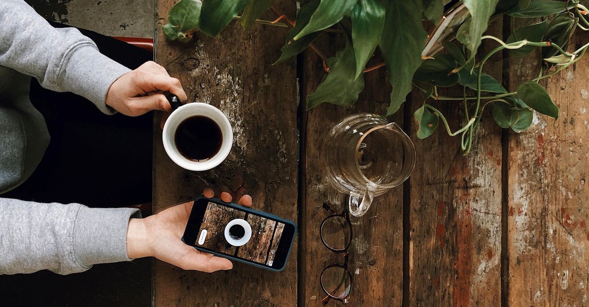 someone doing their daily giveaway entries with morning coffee