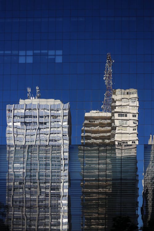 Reflection of Office Buildings in the Glass Facade of a Skyscraper