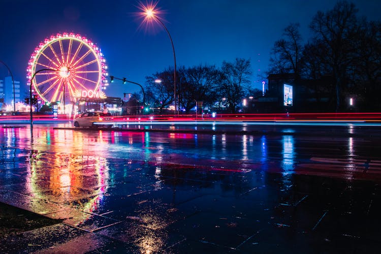 Ferris Wheel Near Body Of Water During Night Time