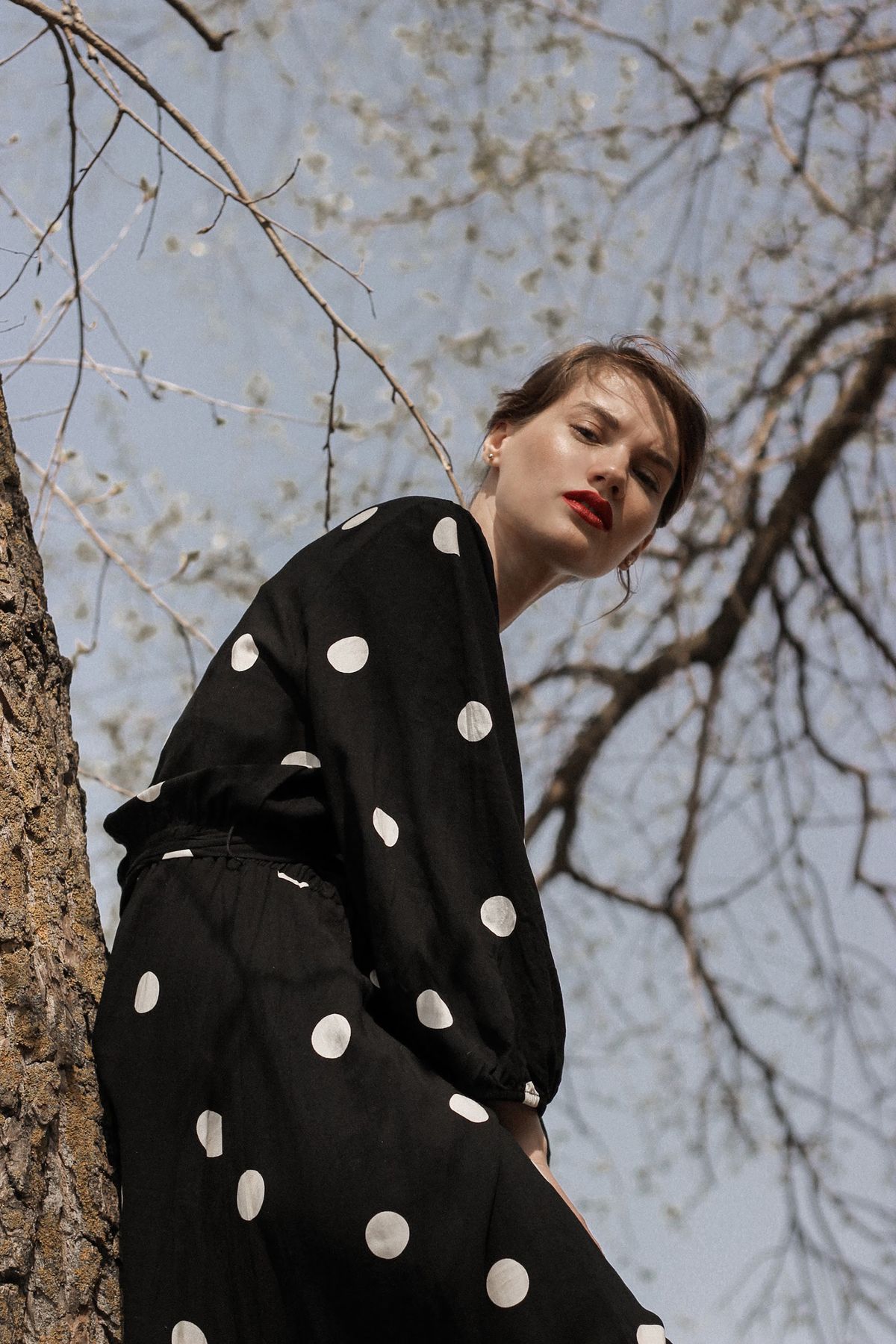 Portrait of a woman in a polka dot dress — the print's modern return