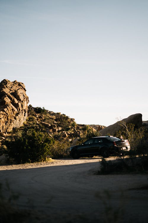 Car parked near stony hill in semidesert