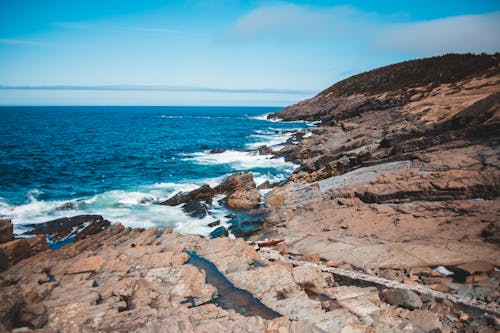 Rocky coast against blue foamy sea