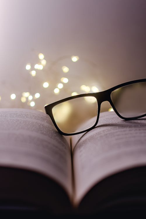 Free A Black Framed Eyeglasses on Book Pages Stock Photo