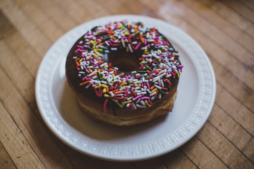 Doughnut With Sprinkles on White Ceramic Plate