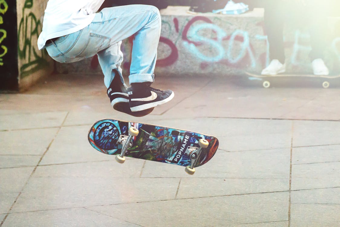 Person Performing Skateboard Tricks