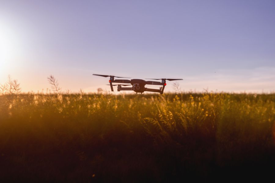 Cloudline Horizon Mini drone flying over a field at sunset