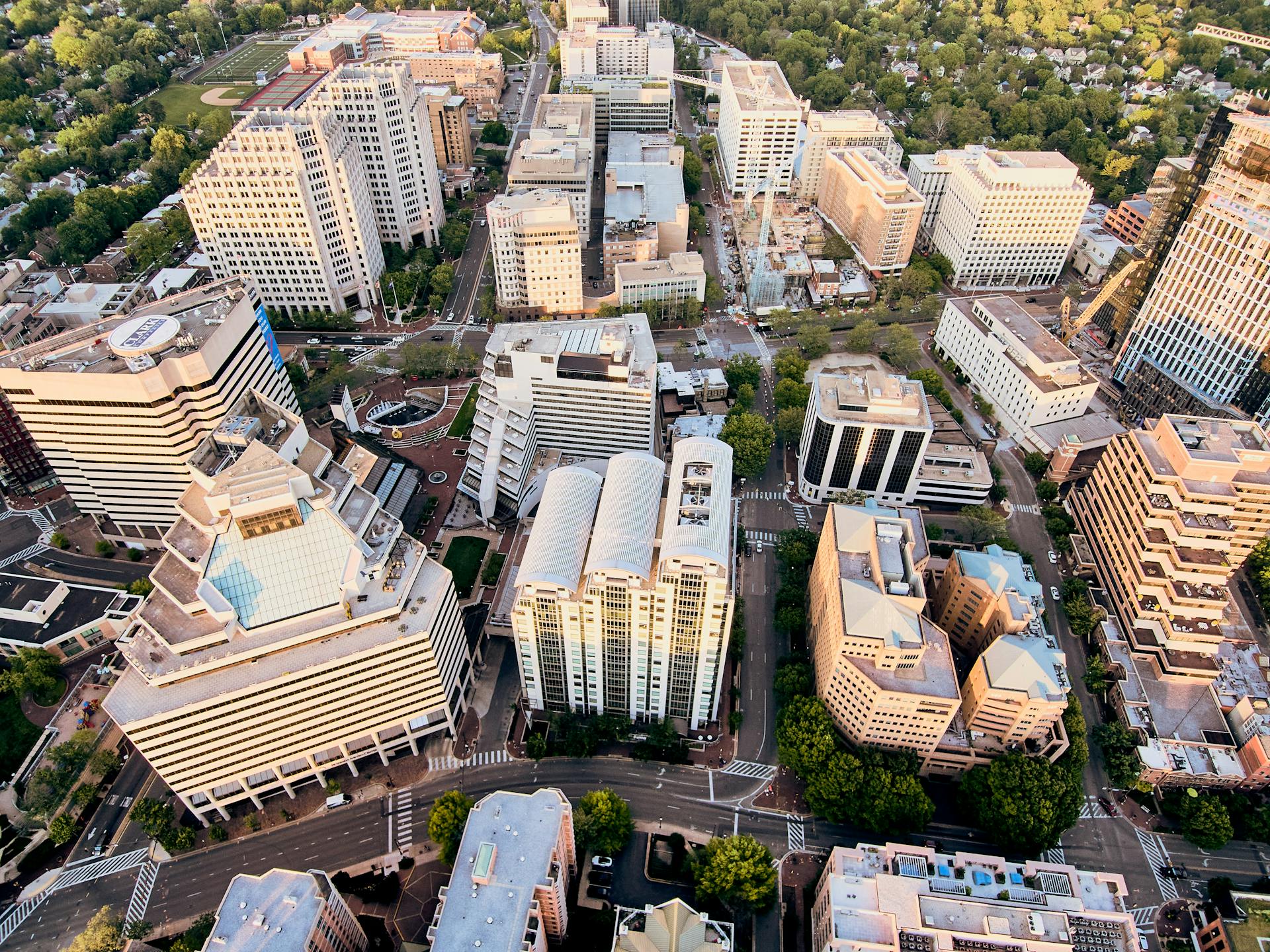 Aerial view of new residential district with contemporary buildings and well developed infrastructure at sunset