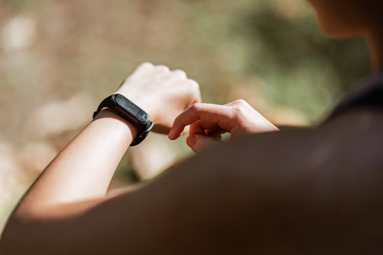 Crop Woman With Fitness Tracker In Nature