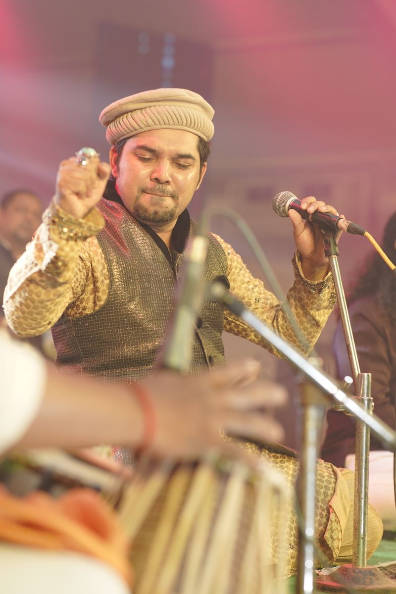 Mike Stevenson holding a microphone on stage